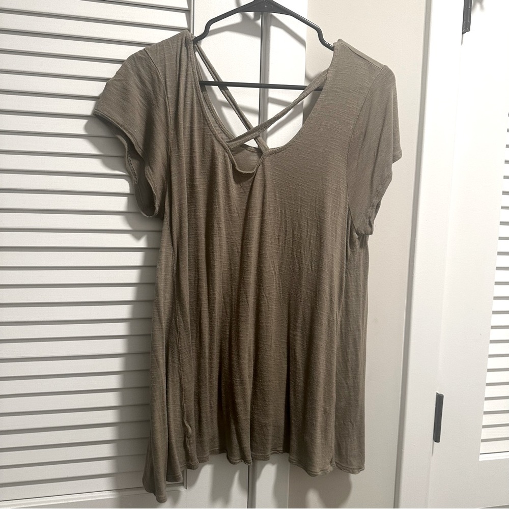Green blouse with cris cross straps
